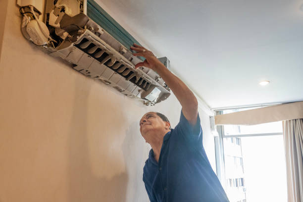istock Technician performs maintenance on the air conditioning of an apartment 1923502596