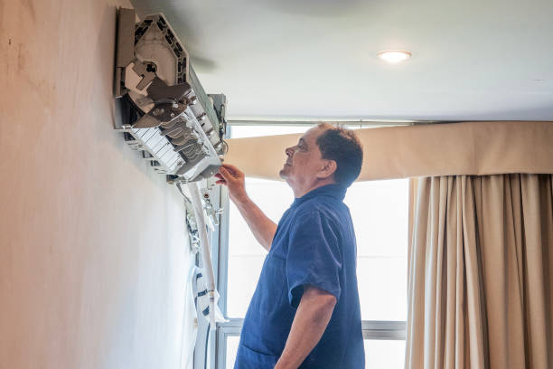 istock Technician performs maintenance on the air conditioning of an apartment 1923503696