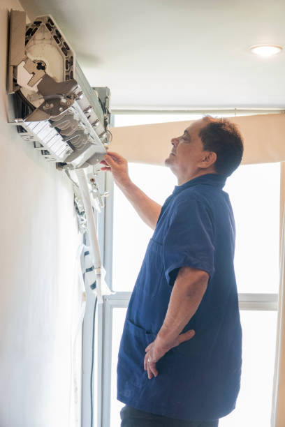 istock Technician performs maintenance on the air conditioning of an apartment 1923503716