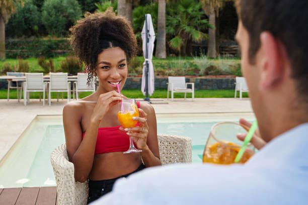 istock Multicultural Couple Enjoying Resort Drinks 1923506750