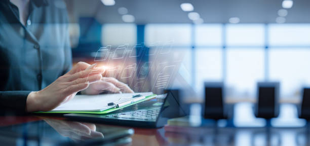Woman manager working on virtual screen with files.