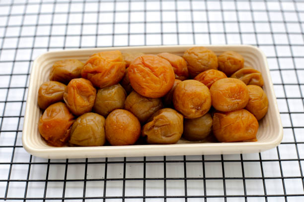 istock Pickled plums in white plate 1923531895