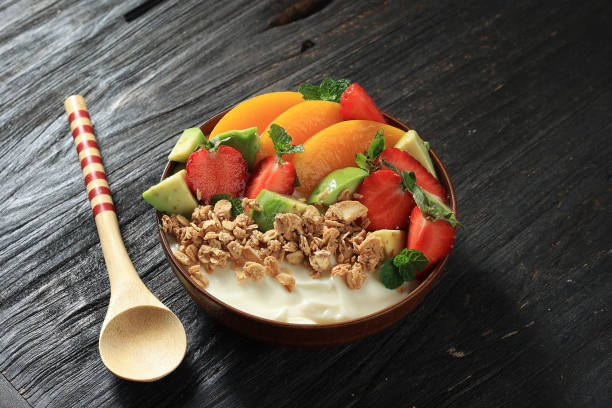 istock Yogurt Bowl with Fresh Berries, Granola, Avocado,  and Peach 1923574896