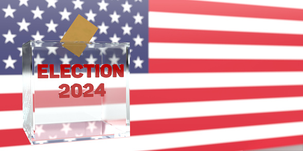 2024 United States presidential election campaign. Drop the yellow voting envelope into the glass ballot box in front of the American flag, large copy space background. Vote in November! Political 3D patriotic American element.