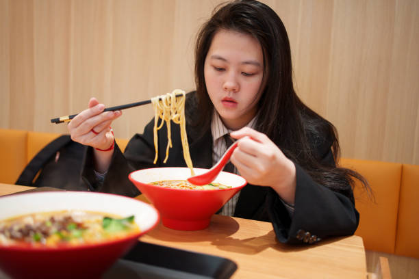 istock woman enjoying pasta 1923632573