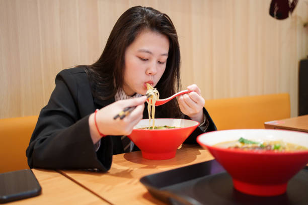 istock Young woman enjoying pasta 1923643147