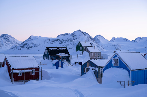 Colourful village and mountain in winter, Kulusuk, Eastern Greenland
