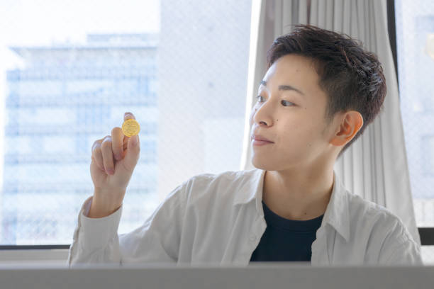 istock gold coin with man 1923662344