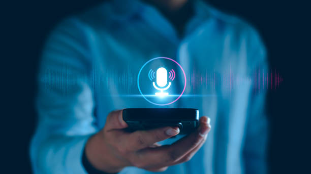 istock Voice recording. Man touching microphone icon on smart phone. Mobile application Record sound, audio, music, voice message. or Use your voice to direct AI to search for information on Internet. 1923678021