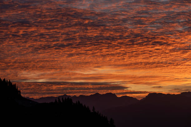 Warm Mountain Sunset with Layers - Layers of mountains fading into the distance as the setting sun creates warm magic golden hour light along high mountain ridge. Summer scenic view with Castle Peak in the Castle Peak Wilderness Study Area in the background.
