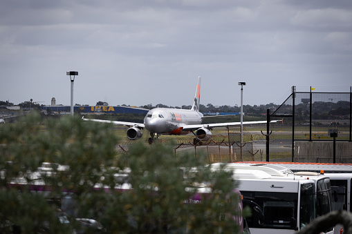 Sydney, Australia - December 17, 2023: Jetstar Airbus A320 taxiing at Sydney Airport.