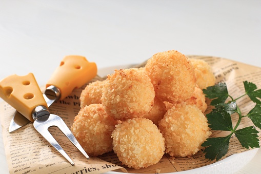 Homemade Deep Fried Risotto Arancini with Cheese or Rice Ball. Made from Rice with Stock, Coating with Bread Crumbs, and Deep Fried