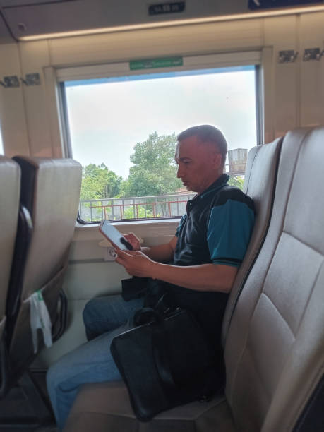 istock Businessman on the train. 1923732340