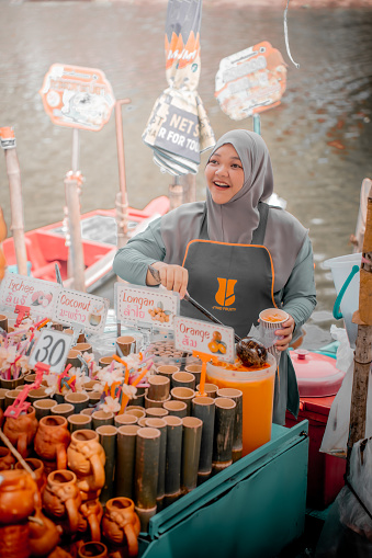 Hat Yai, Thailand- December 15, 2023: A Hijab Woman Selling Variety of Drinks at Khlong Hae Floating Market. Visit Thailand.