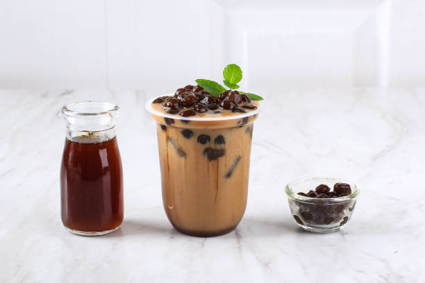 istock Taiwan Ice  Milk Chocolate or Coffee with Boba Tapioca Pearls on Top with Mint Leaf as Garnish 1923784629