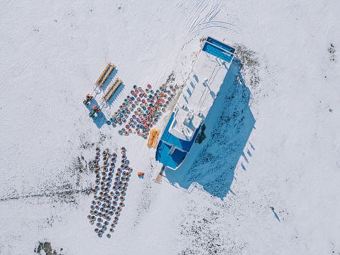 aerial view ship stuck anchored in frozen lake in winter season