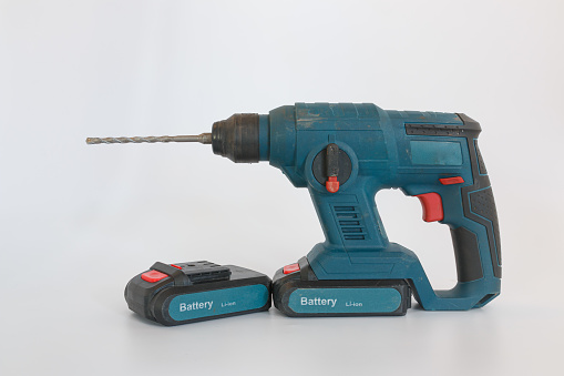 Lithium battery of cordless drill on white background.For drilling or tightening work