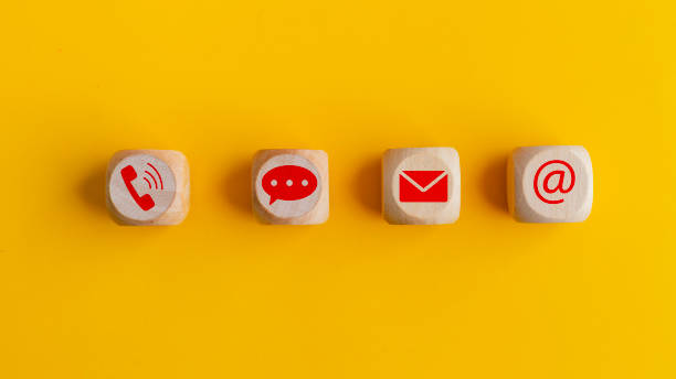 istock Contact icons include message address e-mail and telephone on wooden block cube and blue background for customer hotline service support concept. 1923832162