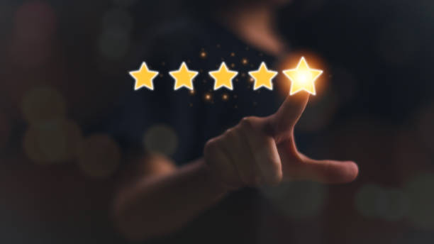 istock Businessmen touch glowing yellow five stars for excellent evaluation after customers use product service, ISO, and quality standard certificate concepts. 1923832172