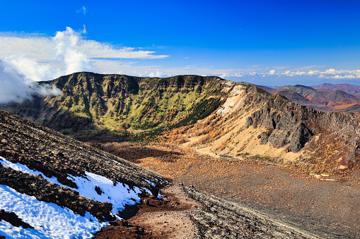 View down to the aktive smoking Santiago Crater of the Pyroclastic Shield Masaya Volcano. Masaya Volcano National Park, south of Managua, Nicaragua.