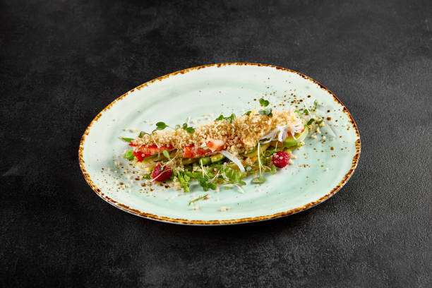 istock Salad with avocado, crab, and quinoa on a speckled turquoise plate 1923859849