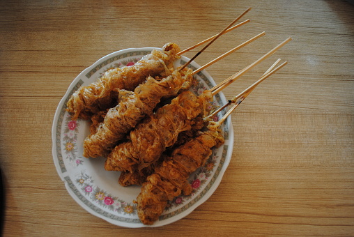 Egg rolls satay are a traditional snack which is a variation of fried eggs. Egg rolls are made by frying eggs, then rolling them using a bamboo stick. This food is often sold in schools, especially in Indonesian elementary schools.