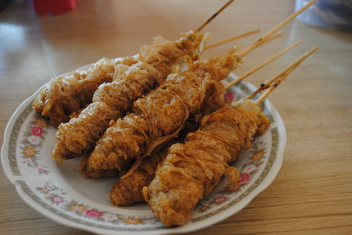 Egg rolls satay are a traditional snack which is a variation of fried eggs. Egg rolls are made by frying eggs, then rolling them using a bamboo stick. This food is often sold in schools, especially in Indonesian elementary schools.