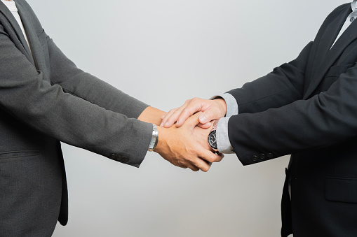 Business partnership meeting concept. Image businessmans handshake. Successful businessmen handshaking after good deal