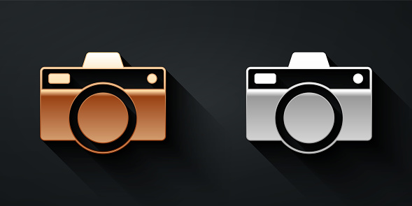 Gold and silver Photo camera icon isolated on black background. Foto camera icon. Long shadow style. Vector.