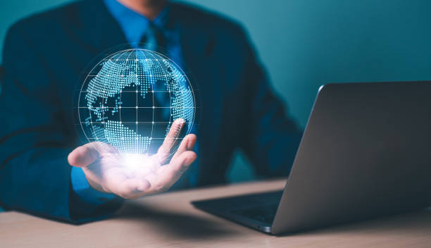istock businessman holds holographic globe, futuristic technology concept created with technology. 1924052932