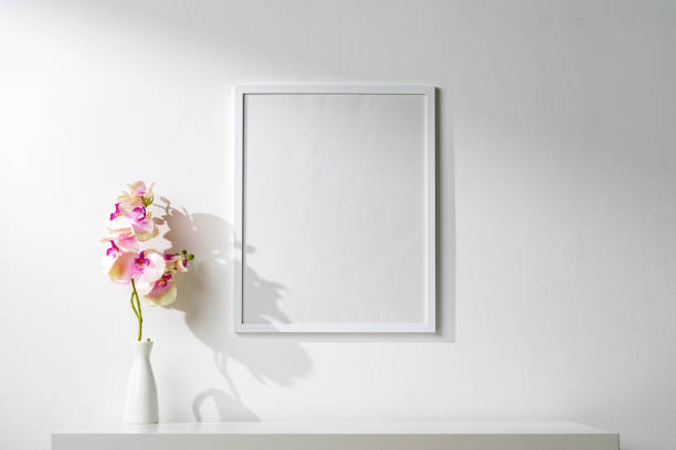 istock White wooden frame on white wall above the table 1924072845