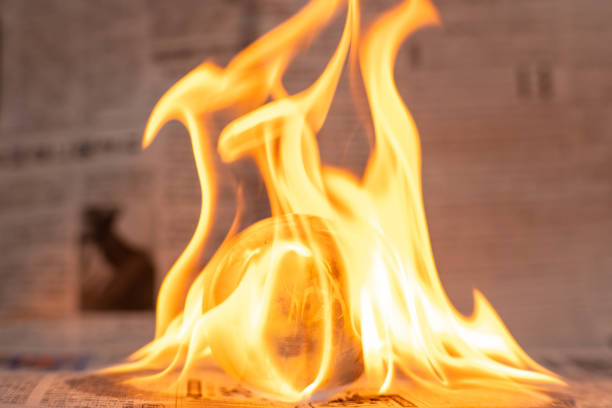 istock Glass globe on fire. Planet Earth Burning. Global Warming and Climate Change Concept. 1924084970
