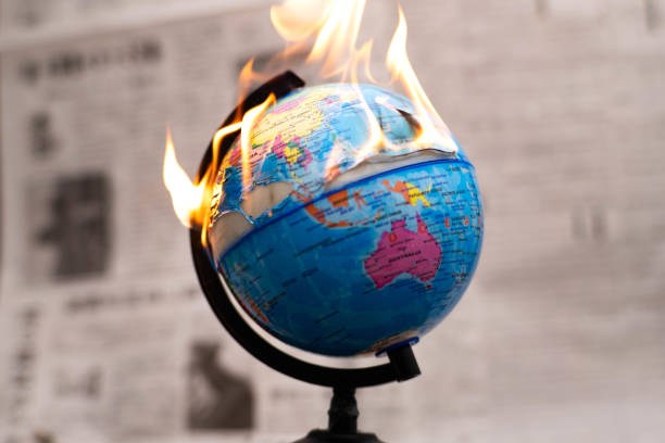 istock Model globe on fire. Planet Earth Burning. Global Warming and Climate Change Concept. 1924084989