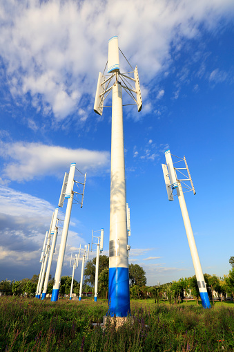 vertical axis wind turbine under blue sky