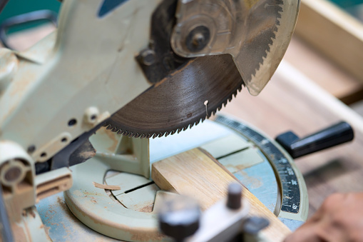 Close up of work tool at wooden workshop. Factory and Blue collar worker concept.