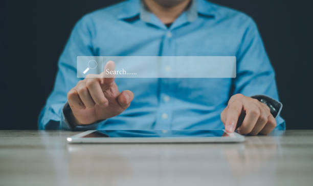 istock search find your career man using tablet working with bar online 1924137662