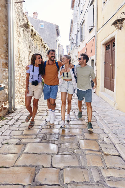 istock Cheerful tourists having fun while walking on the street. 1924139237