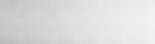 istock Panoramic grey paint limestone texture background in white light seam home wall paper. Back flat wide concrete stone table floor concept surreal granite quarry stucco surface grunge panorama landscape. 1924150817