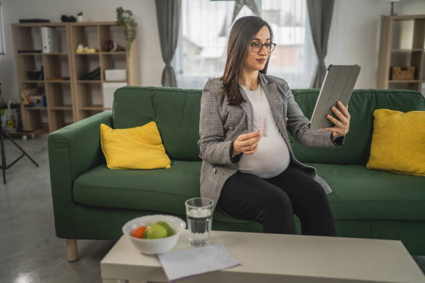 istock Expectant woman read leaflet take tablets medication or supplement 1924165077