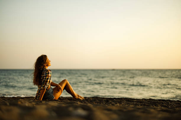 istock Relaxed woman enjoying on the beach. 1924170394