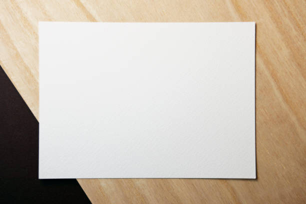 istock Blank business card on wood background. 1924187674