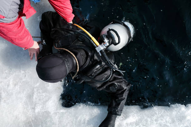 istock Diver is getting out of an ice hole in winter 1924194629