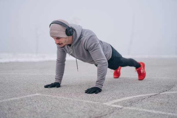 istock Doing push-up exercises at the outdoor gym 1924207449