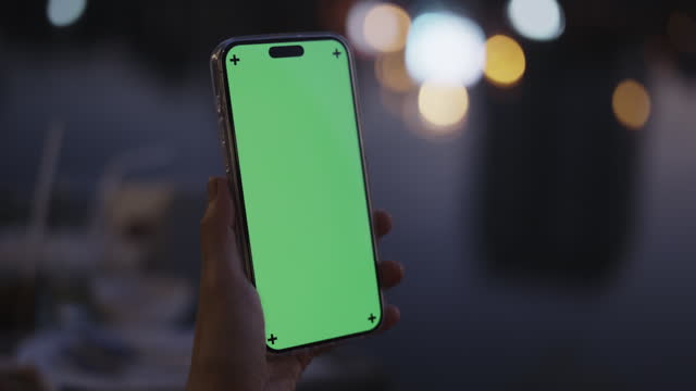 Woman using chroma key green screen  smartphone