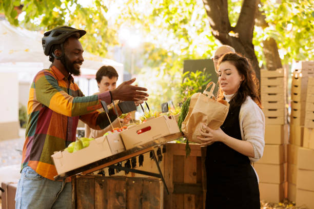 istock Deliveryman helps with produce shipping 1924214904