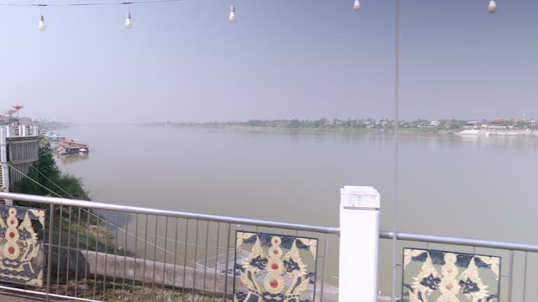 Walking shoot on the bridge over the Mekong River between the borders of Thailand and Laos.