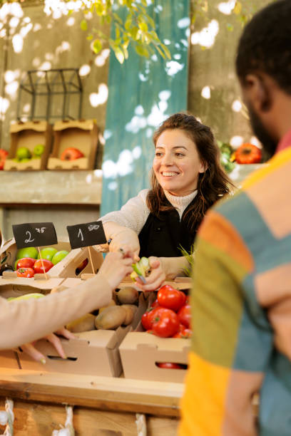 istock Customer tastes piece of fresh apple 1924231800