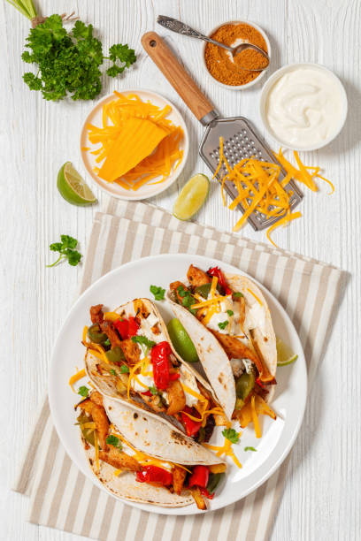 istock baked tex-mex chicken fajitas on a plate, top view 1924232315