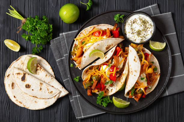 istock baked tex-mex chicken fajitas on a plate, top view 1924232316