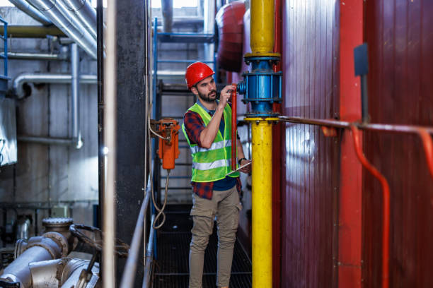 istock Young Man at Heating Plant Using Digital Tablet to Manage Operations 1924246805